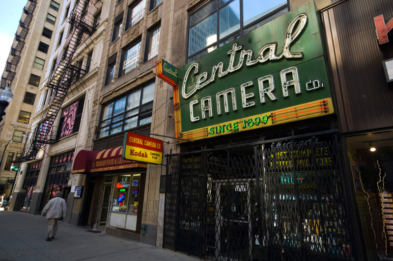 An elaborate neon sign on a camera store.
