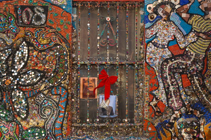 A mosaic of bright tiles decorates a home.