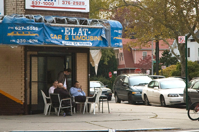 Four drivers pass the time outside a car service.