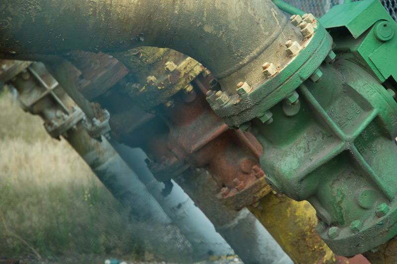 A series of industrial pipes and fittings.